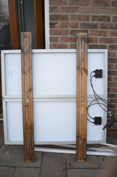 The panels are bolted onto two length of wood which are then fixed to the roof rack.