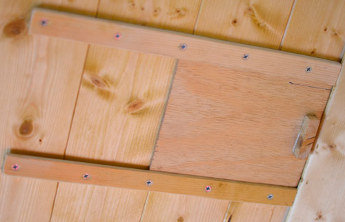 I made this shutter for the roof vent out of spare plywood