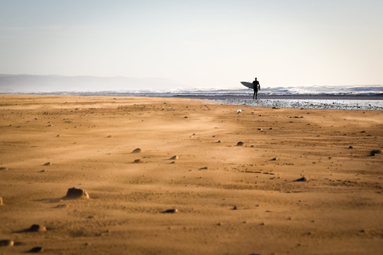 Morocco-by-campervan-sidi-kaouki-beach-surfer