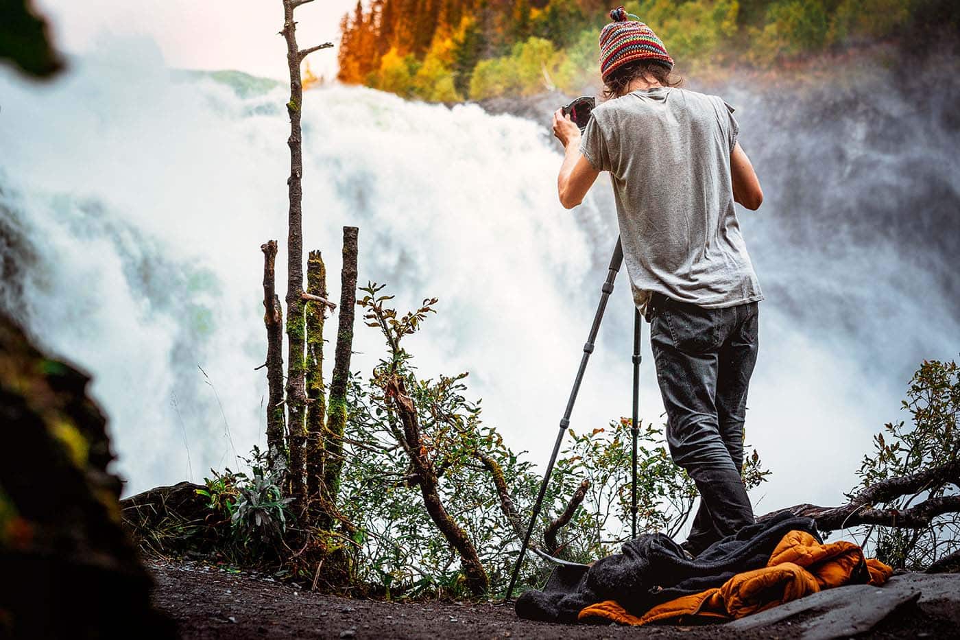 taking a long exposure photo of Tännforsen waterfall in Sweden