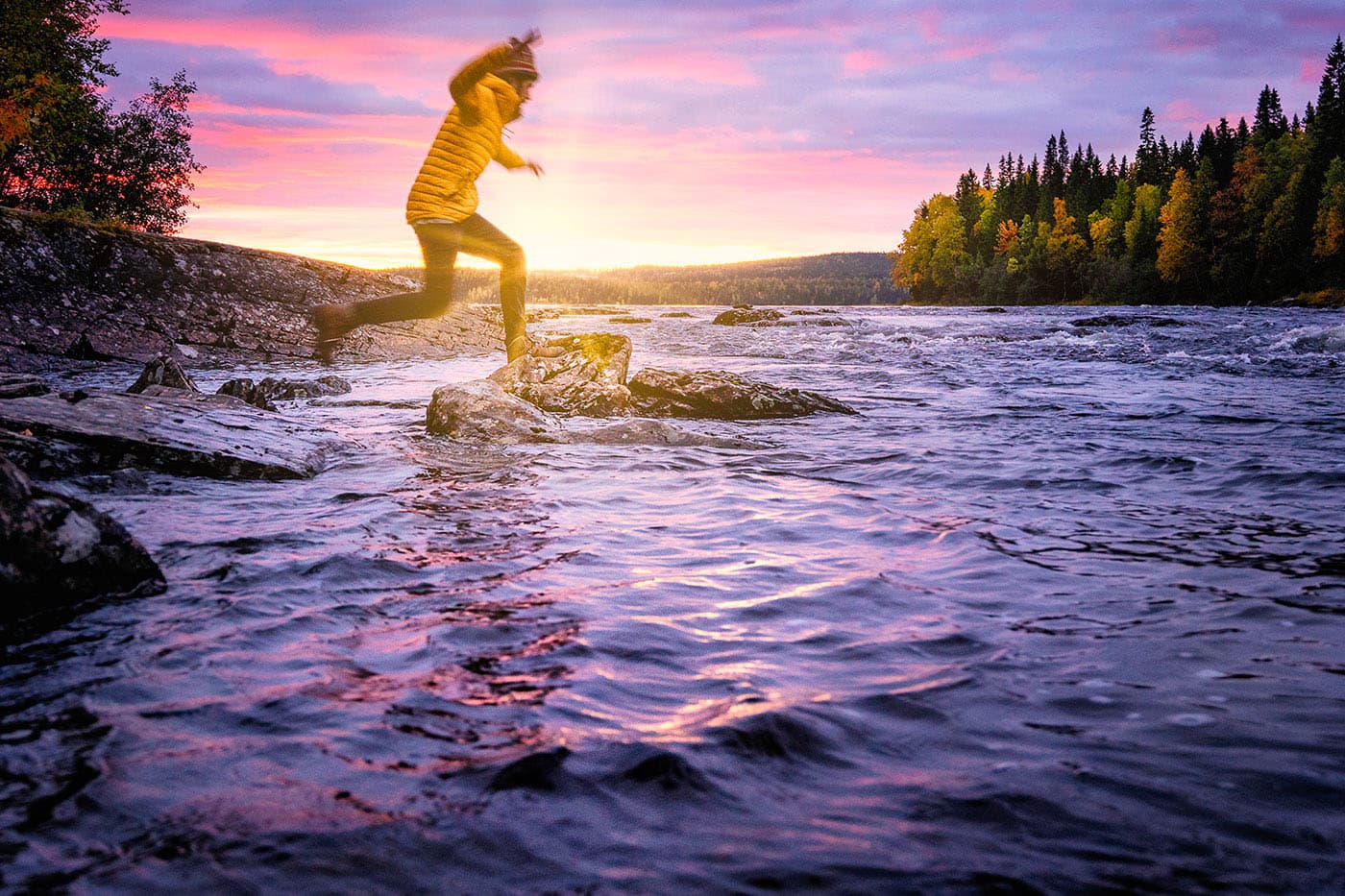 jumping between rocks at sunset, Tännforsen