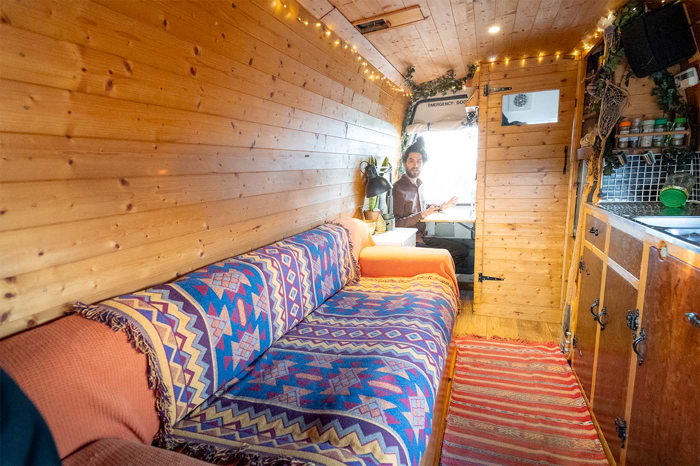 mike sat inside his DIY campervan