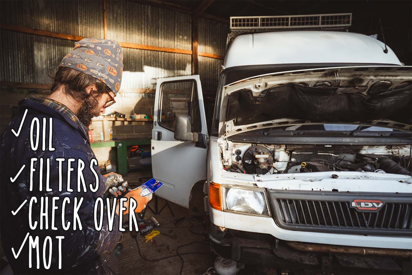 mike doing a service to his campervan