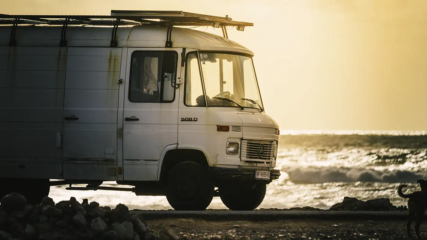 old mercedes van on beach